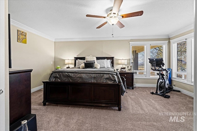 bedroom with a textured ceiling, ornamental molding, and baseboards