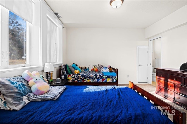 bedroom featuring visible vents