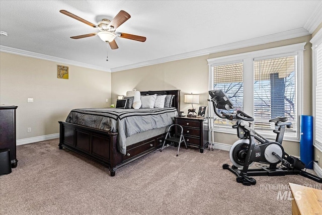 carpeted bedroom featuring baseboards, a textured ceiling, a ceiling fan, and crown molding