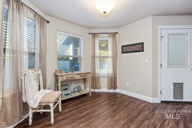 sitting room featuring wood finished floors and baseboards