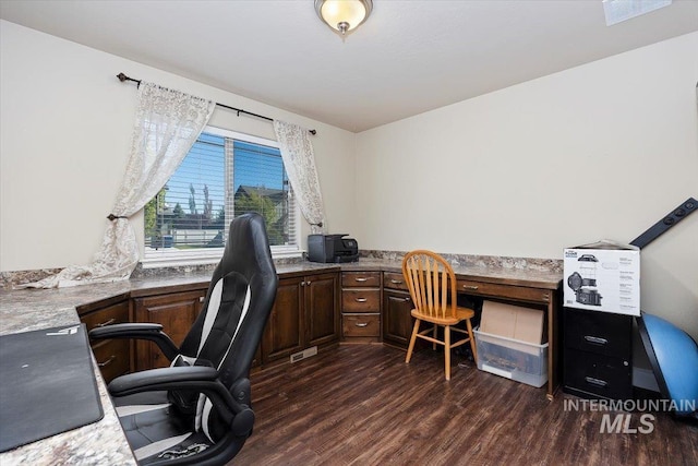 home office featuring dark wood-style flooring and built in study area