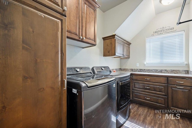 laundry area with washer and dryer, cabinet space, and dark wood-style floors