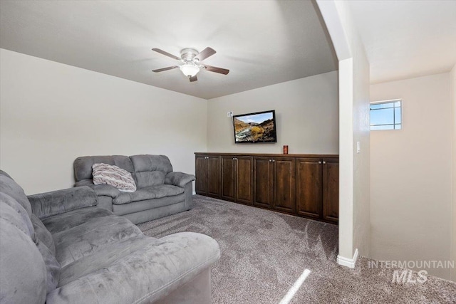 living room with light carpet and a ceiling fan