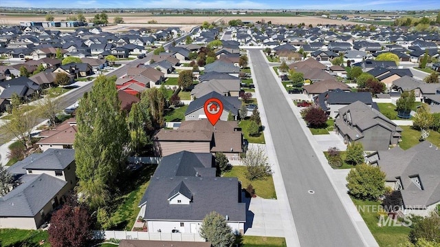 birds eye view of property with a residential view