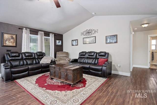 living area featuring baseboards, wood finished floors, a ceiling fan, and vaulted ceiling