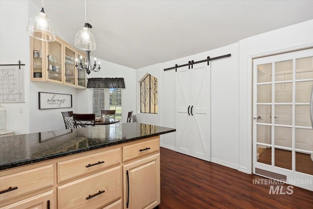 34 S 150 E, Burley, ID 83318 - kitchen with vaulted ceiling, light brown cabinetry, a chandelier, dark wood-style flooring, and glass insert cabinets