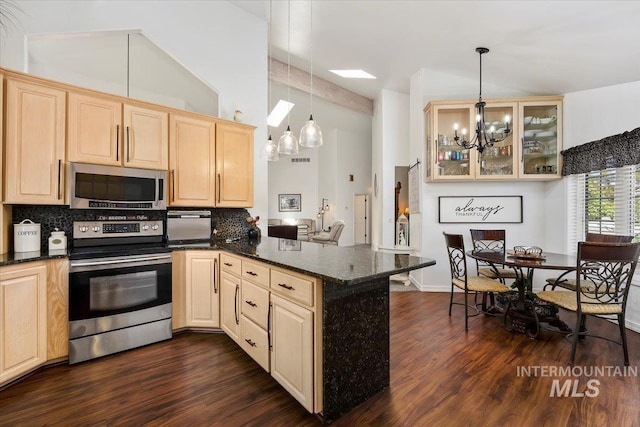 34 S 150 E, Burley, ID 83318 - kitchen featuring appliances with stainless steel finishes, light brown cabinets, a peninsula, a chandelier, and dark wood-type flooring