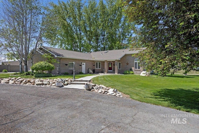 34 S 150 E, Burley, ID 83318 - single story home with a front yard and brick siding