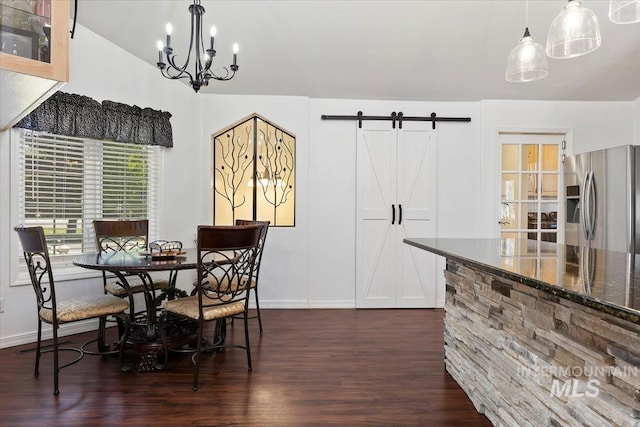 34 S 150 E, Burley, ID 83318 - dining room featuring dark wood-style flooring, baseboards, a chandelier, a barn door, and lofted ceiling