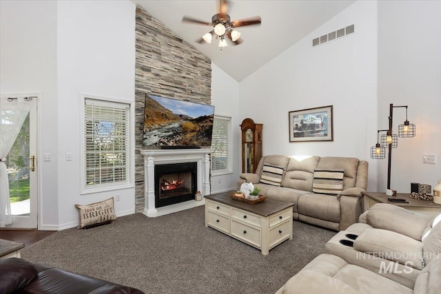 34 S 150 E, Burley, ID 83318 - living area featuring high vaulted ceiling, a ceiling fan, a large fireplace, plenty of natural light, and baseboards