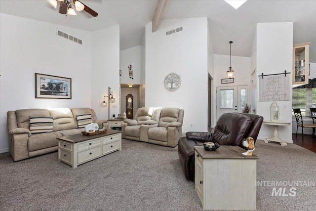 34 S 150 E, Burley, ID 83318 - carpeted living area featuring high vaulted ceiling, a ceiling fan, and beamed ceiling
