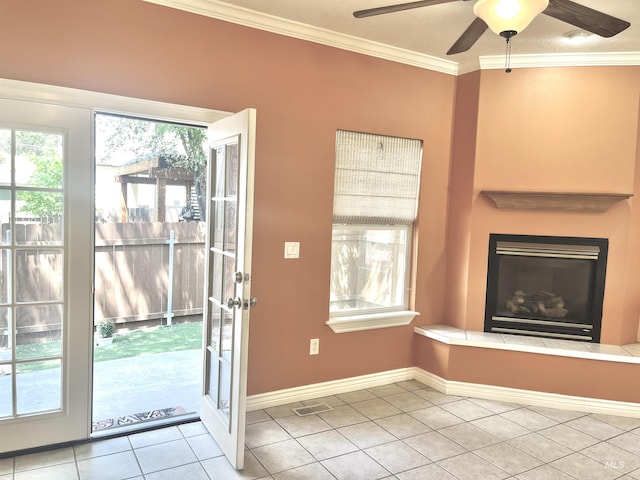 2910 W Hazel St, Boise, ID 83702 - entryway with tile patterned floors, ceiling fan, ornamental molding, a large fireplace, and baseboards