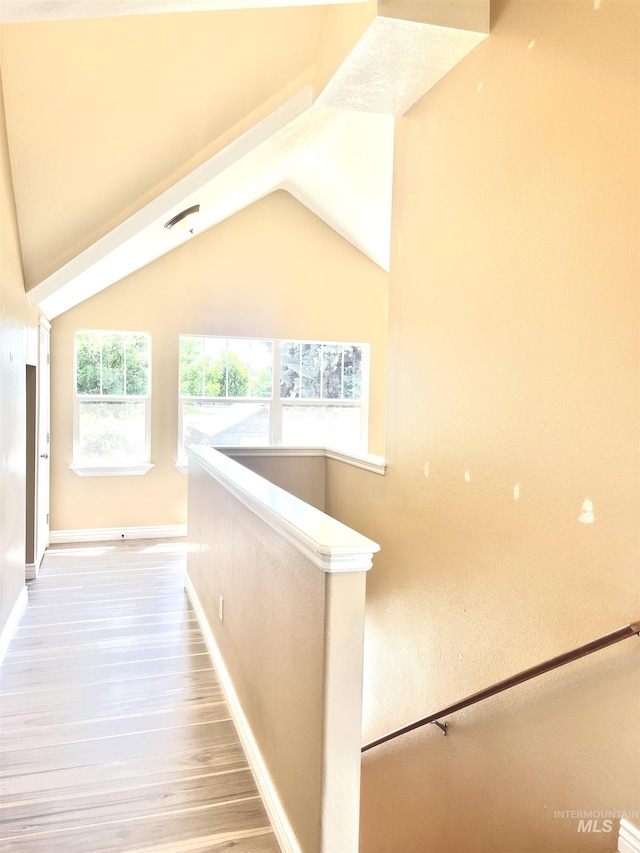 2910 W Hazel St, Boise, ID 83702 - corridor featuring wood finished floors, baseboards, and lofted ceiling