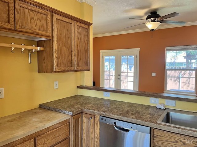 kitchen with dishwasher, brown cabinets, healthy amount of natural light, ornamental molding, and ceiling fan