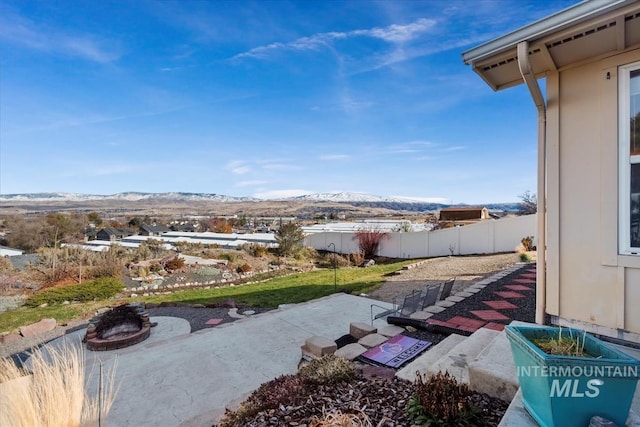 view of yard with a mountain view and a patio