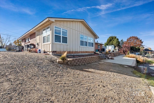 view of property exterior with a patio