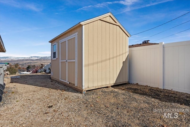 view of outbuilding with a mountain view