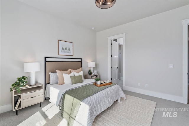 carpeted bedroom with baseboards