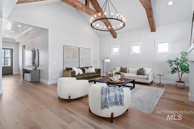 living room featuring light wood finished floors, recessed lighting, high vaulted ceiling, beamed ceiling, and baseboards