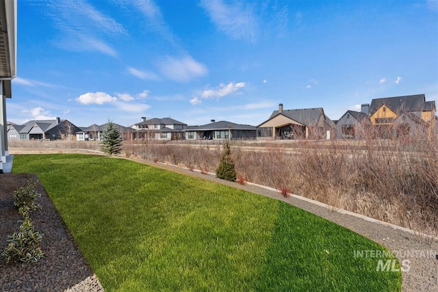 view of yard with a residential view