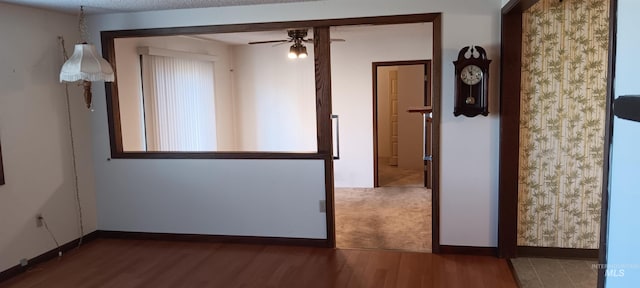 unfurnished room featuring ceiling fan and wood-type flooring