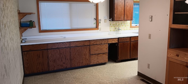 kitchen featuring decorative backsplash and sink