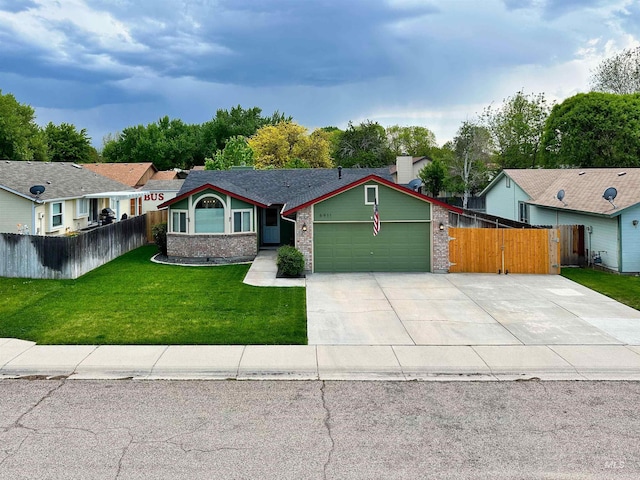 view of front of house featuring an attached garage, a front lawn, fence, and brick siding