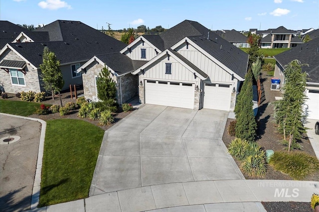 view of front of house featuring a garage and a front lawn