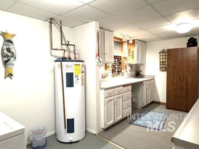 utilities featuring washer / clothes dryer and water heater