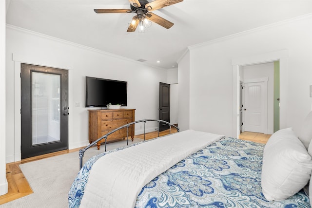 bedroom with crown molding and ceiling fan