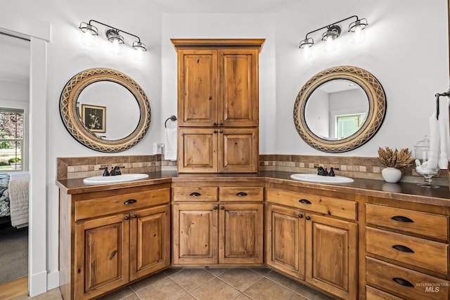 bathroom with tile patterned flooring and vanity