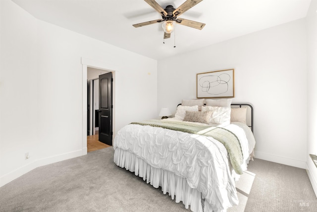 bedroom with light colored carpet and ceiling fan