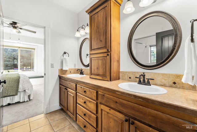 bathroom featuring tile patterned flooring, vanity, and ceiling fan