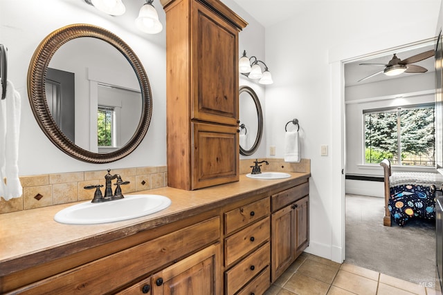 bathroom featuring ceiling fan, vanity, and tile patterned flooring