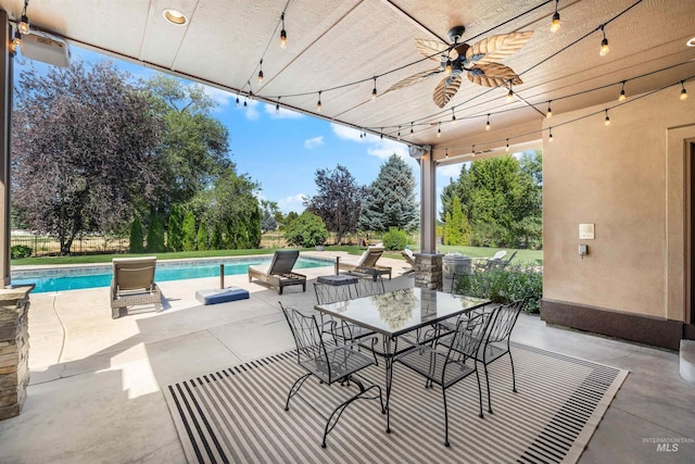 view of patio featuring ceiling fan