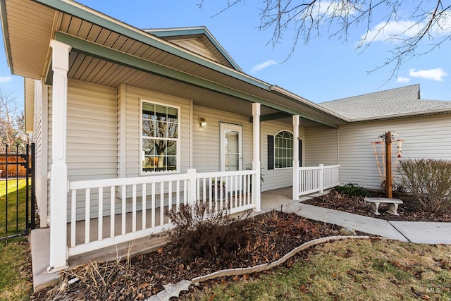 doorway to property featuring covered porch