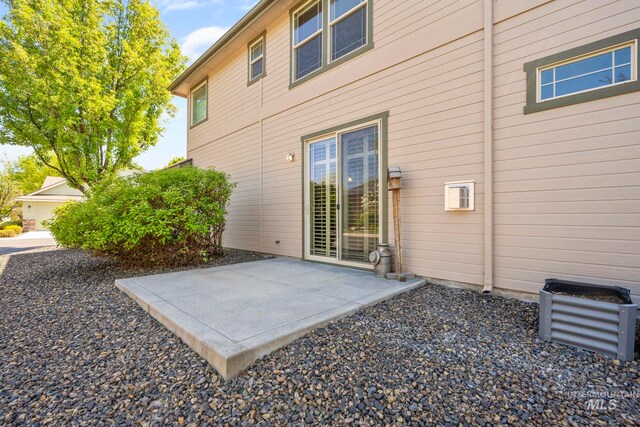 back of property with a patio area