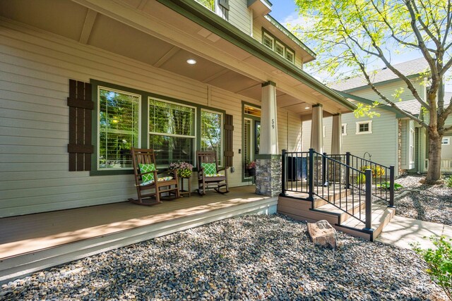 view of exterior entry with a porch