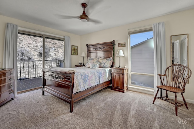 bedroom featuring a ceiling fan, access to exterior, and carpet flooring