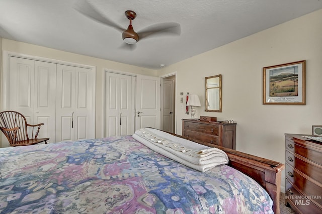 bedroom featuring two closets and ceiling fan