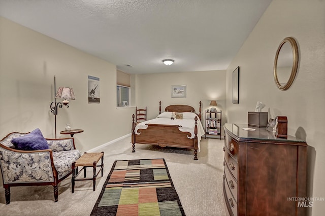 carpeted bedroom featuring baseboards