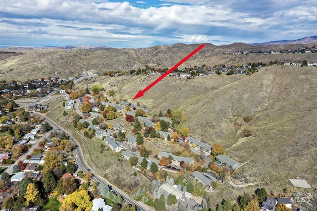 drone / aerial view featuring a mountain view