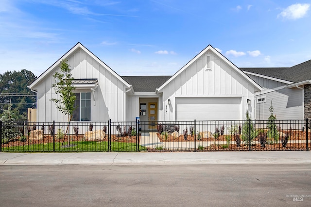 modern inspired farmhouse with a garage