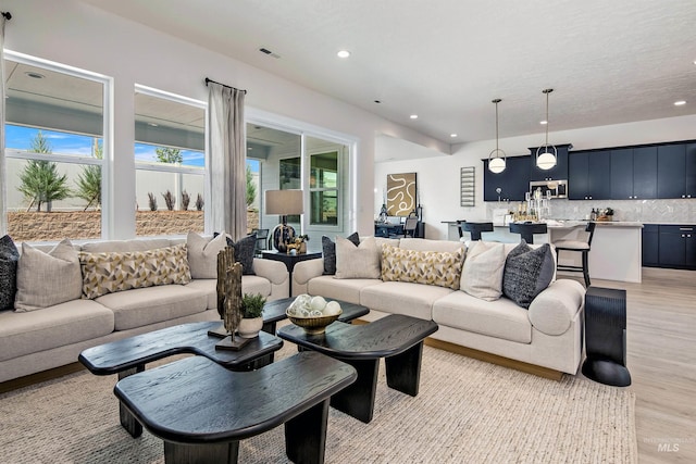 living room with light hardwood / wood-style flooring