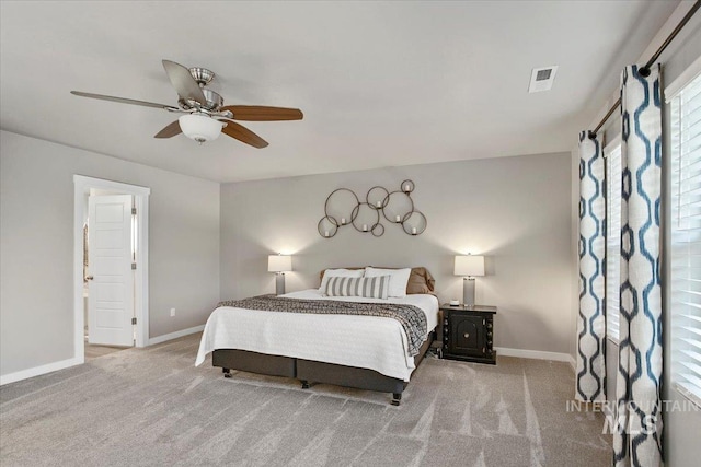 bedroom featuring ceiling fan and light carpet