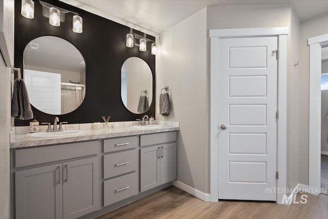 bathroom featuring hardwood / wood-style flooring and vanity