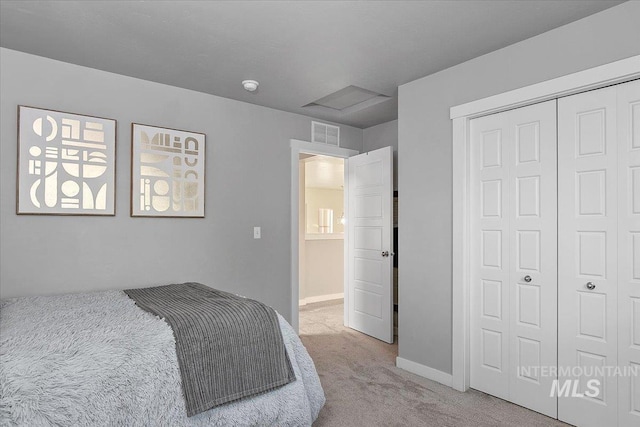 carpeted bedroom with a closet