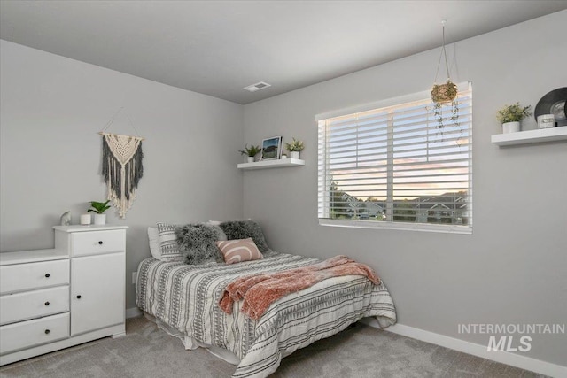 bedroom with light colored carpet