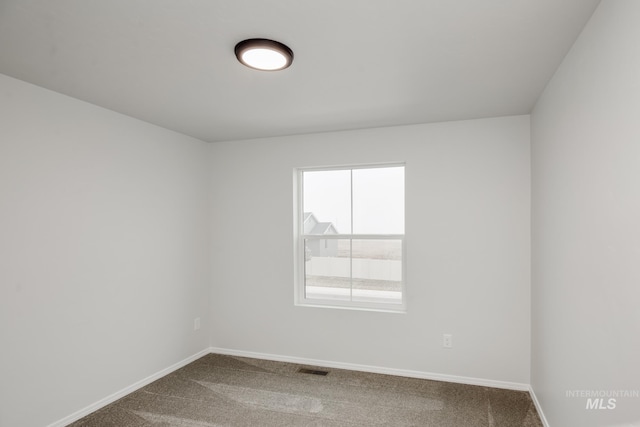 2219 W Cascara St, Kuna, ID 83634 - spare room featuring baseboards and carpet floors