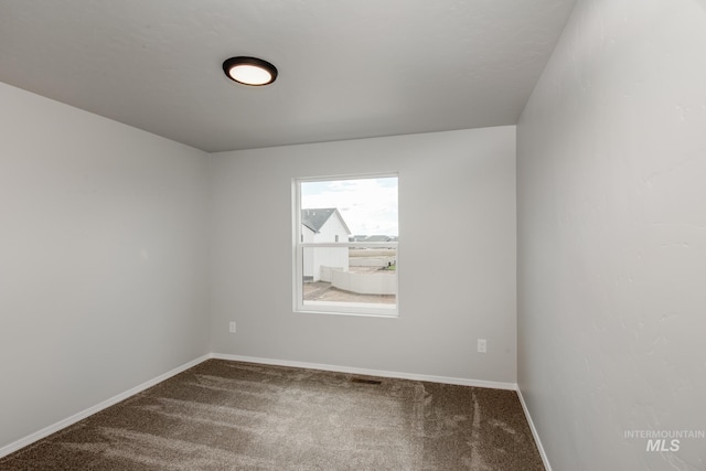 empty room with carpet flooring